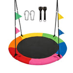 Colorful round saucer swing equipped with festive pennant flags, heavy‑duty tree hanging straps and safety carabiners. Fun outdoor platform swing for kids backyard play.