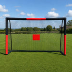 Front perspective outdoor children football goal net with red target marker on sunny backyard field