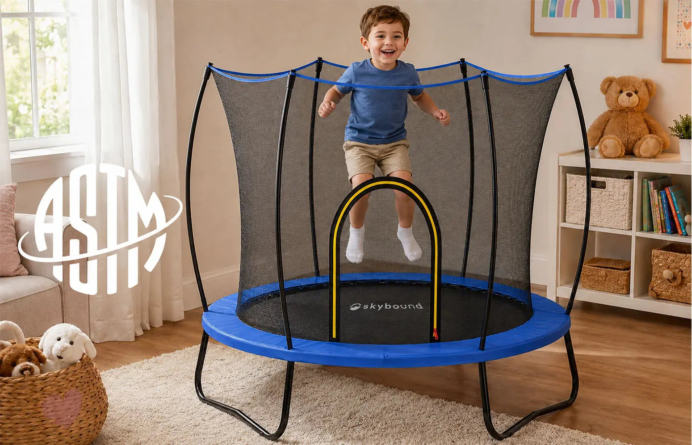 SkyBound kids trampoline ASTM certified, boy jumping indoors on safe trampoline with enclosure net, meets F963 F381 F2225 and AS4989 safety standards