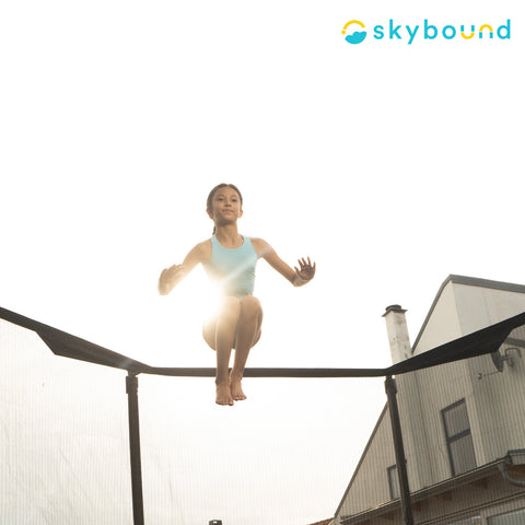Image of girl jumping on a Trampoline.  