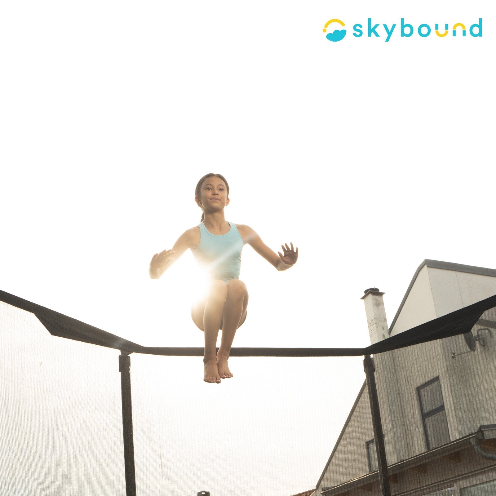 Girl Jumping on Trampoline.